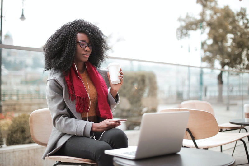 Female Student with Laptop and Coffee Cup