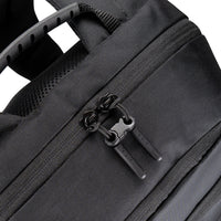 Close-up of a black backpack zipper with brand logo on a white background