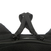 Close-up of a black backpack strap on a white background