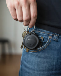 black universal locator on keyring in pocket