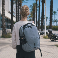 Targus terra laptop backpack worn by woman walking down street