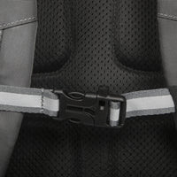 Close-up of a car seat belt buckle on a black car seat with gray straps.