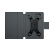 Black device with straps on a gray stand against a white background
