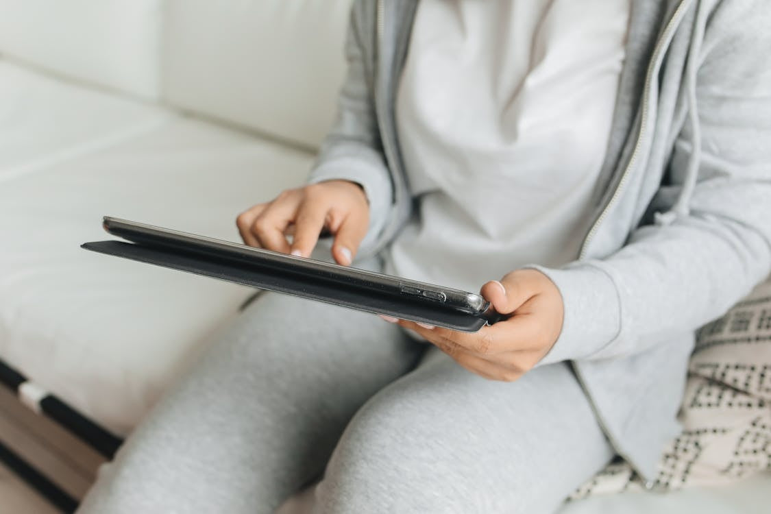 A person with a tablet learning how to clean an iPad case