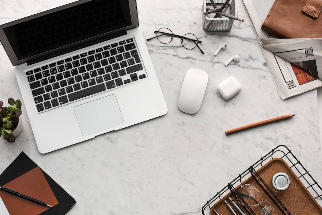 A marble surface displaying popular travel tech gifts