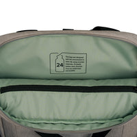 Open view of a gray and sage green backpack showing the interior lining and a printed recycling label inside the top compartment.