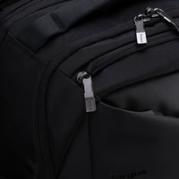 Close-up of a black backpack with zippers and 'Targus' branding.