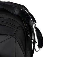 Close-up of a black backpack strap on a white background
