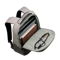A gray and black backpack shown open, revealing its interior compartments filled with a laptop, notebook, and other accessories, on a plain white background.