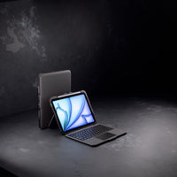 Tablet with keyboard case on a dark surface