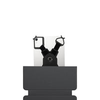 Black phone holder with a smartphone on a white background