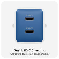 A blue dual USB-C charging adapter with two USB-C ports, shown on a light gray background with text below reading 'Dual USB-C Charging' and 'Charge two devices from a single charger.'.