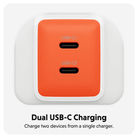 An orange dual USB-C charging adapter with two USB-C ports, shown on a light gray background with text below reading 'Dual USB-C Charging' and 'Charge two devices from a single charger.'.